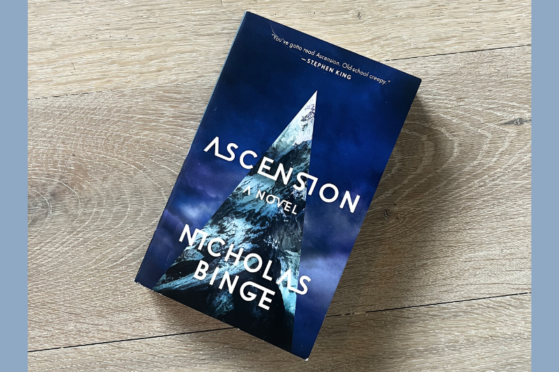ascension - blue book on wood background